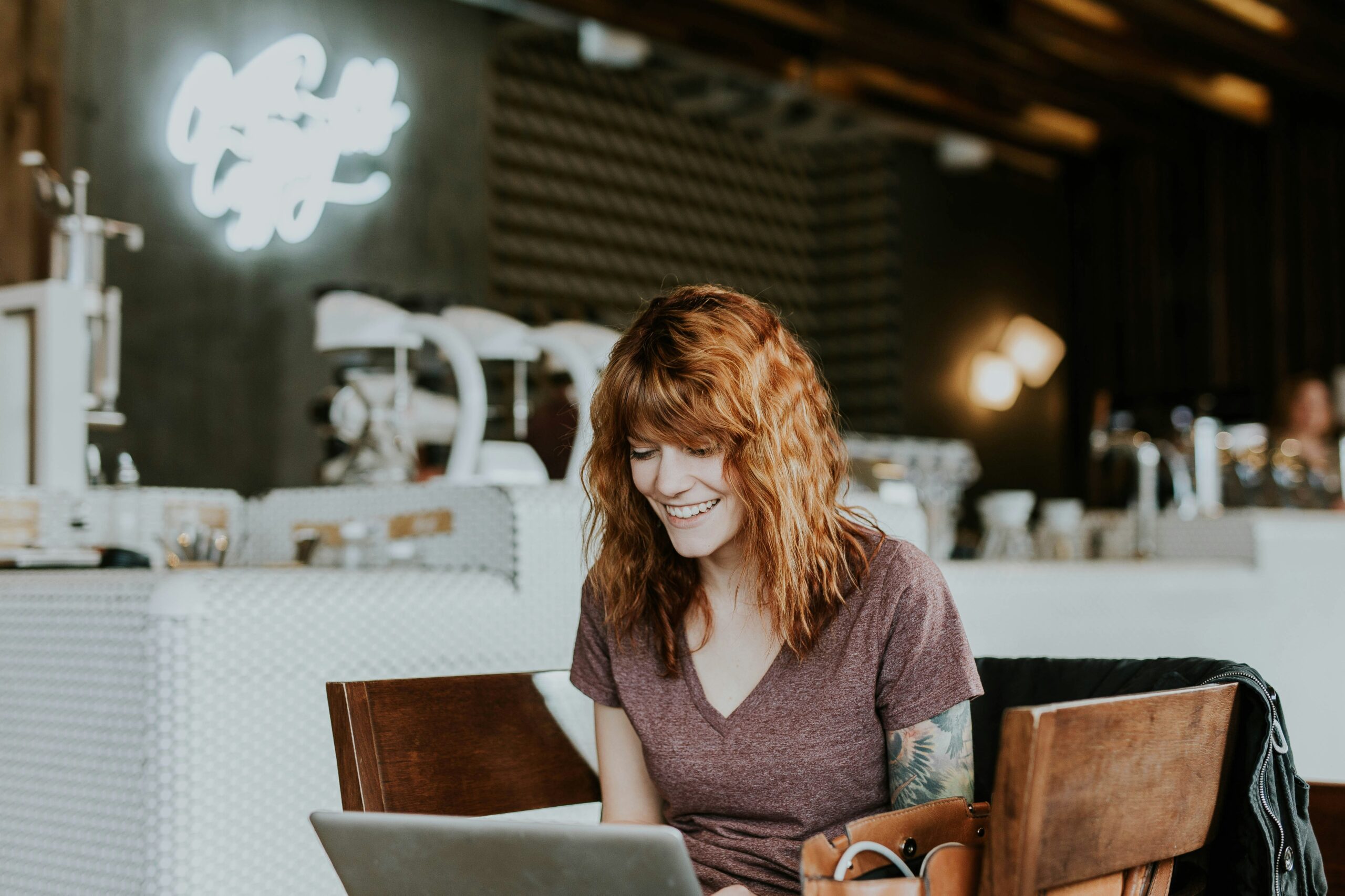 woman-smiling-at-laptop-looking-at-digital-marketing-services-near-me