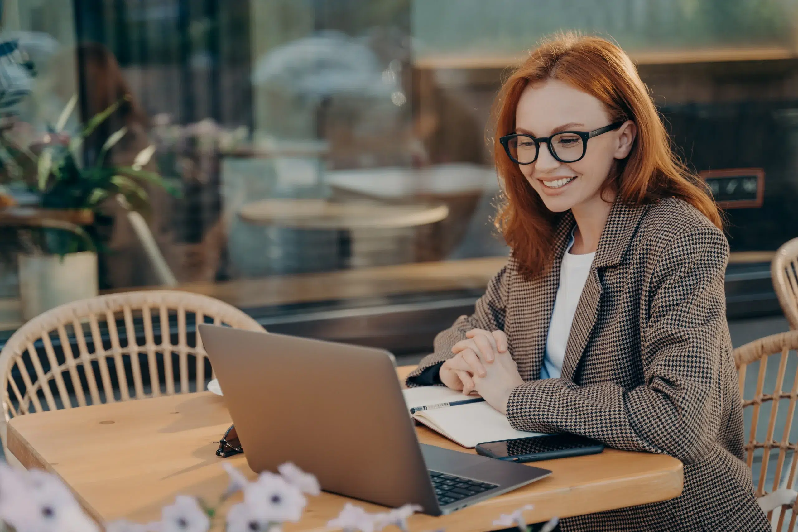 women working on seo content creation strategy in a coffee shop